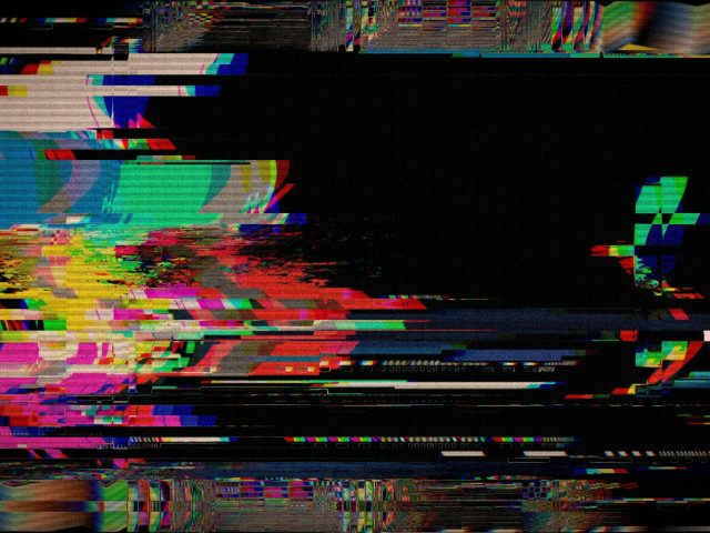 Colourful digital static noise on a black screen