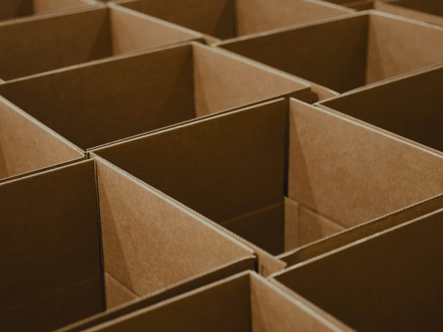 Stacks of open cardboard boxes
