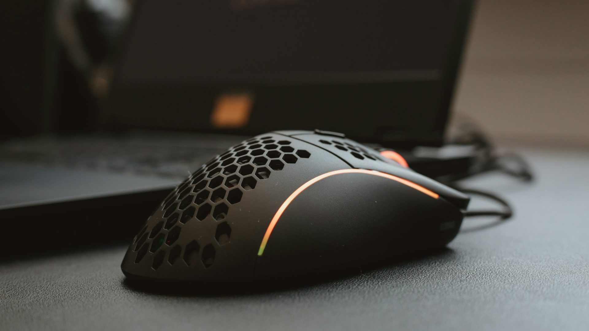 A corded computer mouse on a desk