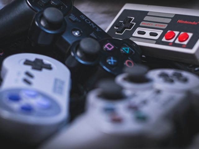 A white game controller on a plain background