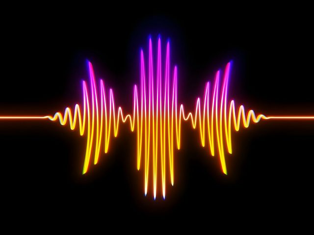 A colourful sound waveform on a black background