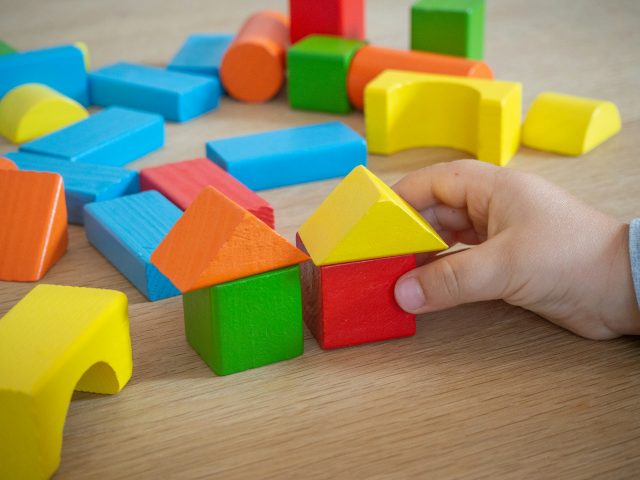 Assorted coloured wooden building blocks