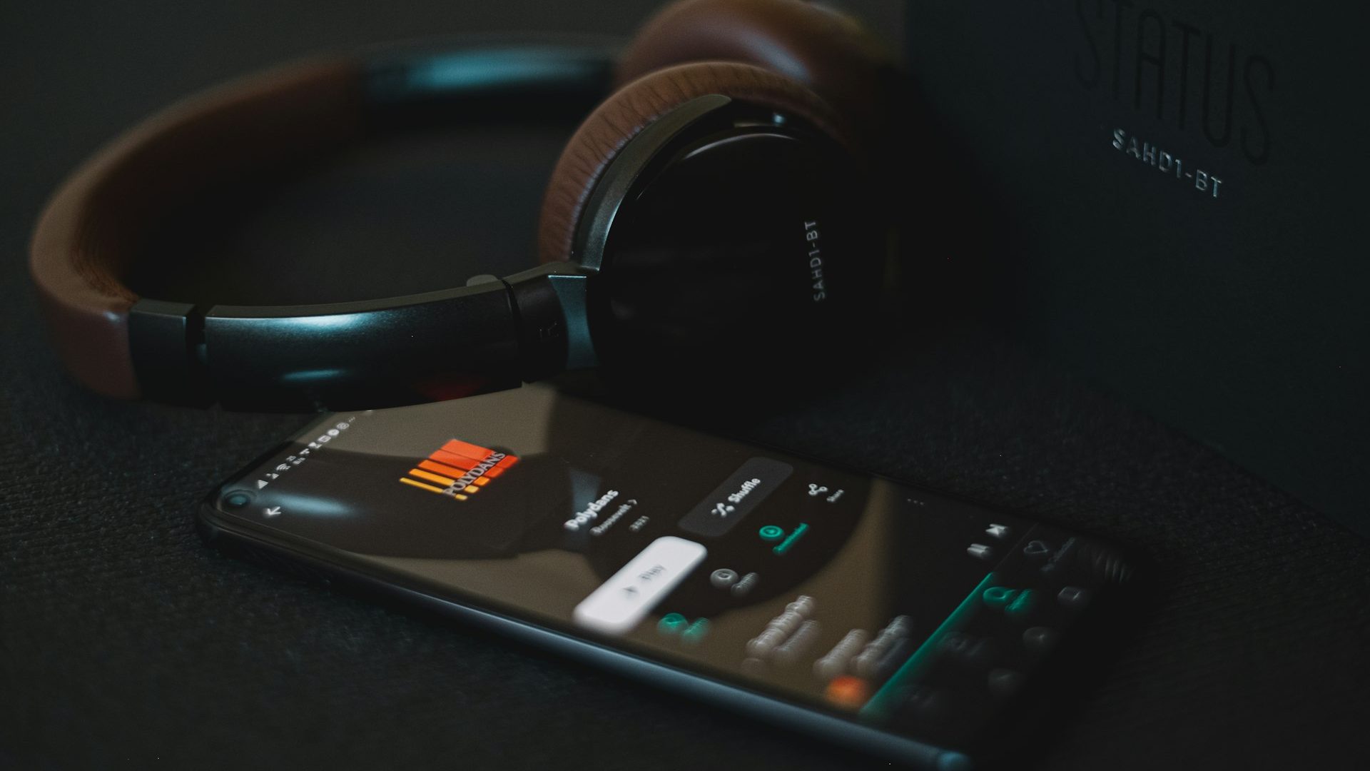 Headphones beside a remote control