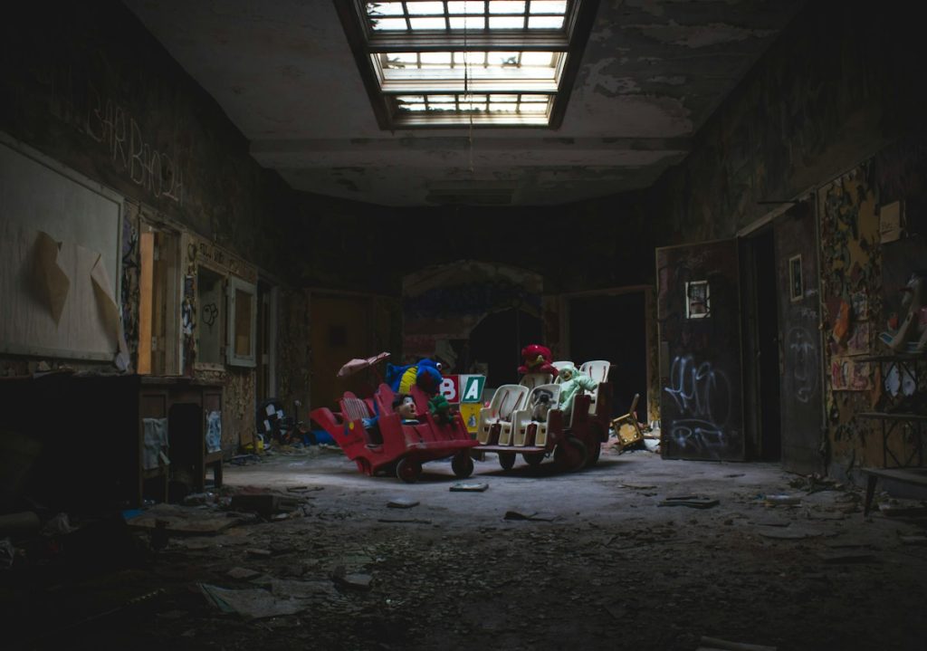 An abandoned playroom with peeling paint