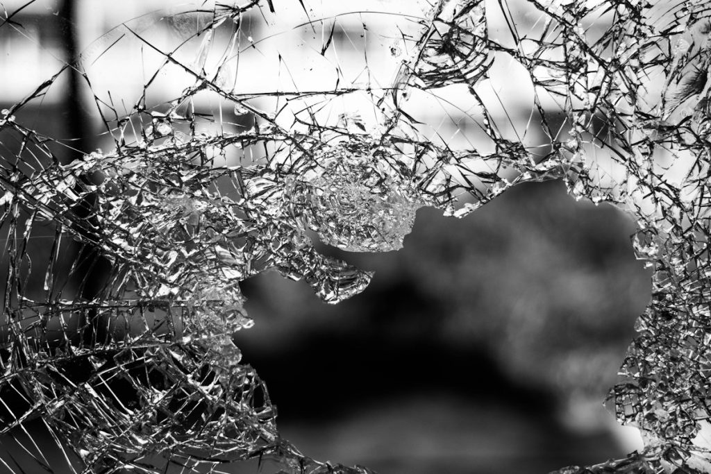 A cracked glass screen photographed close-up