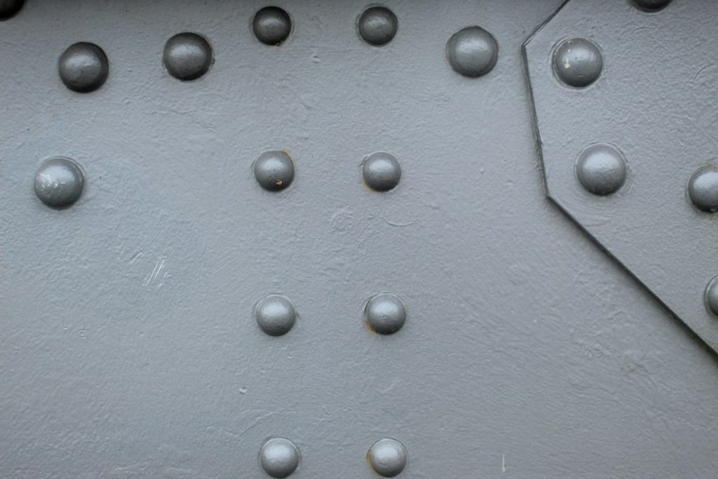 A riveted metal surface in close-up