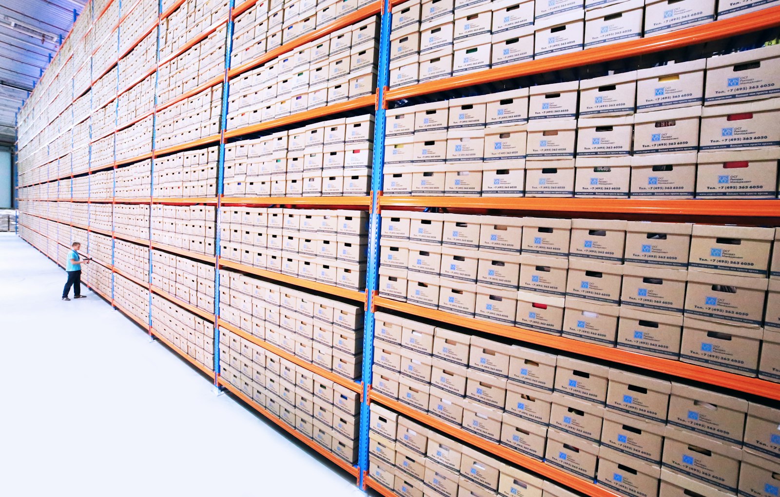 A tall wooden cabinet of small archive drawers