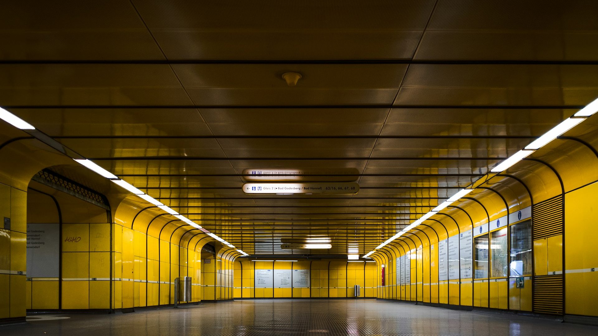An empty hallway lit by overhead lights