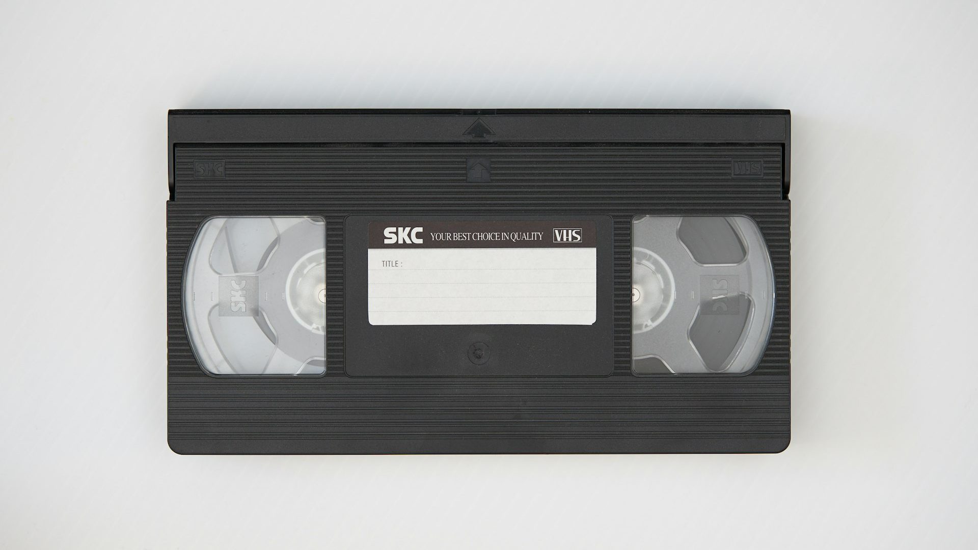 A black cassette tape on white fabric
