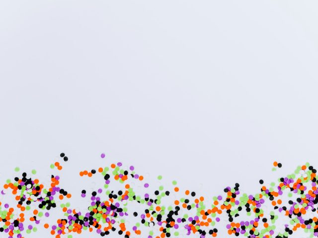 Multicoloured balls scattered across a bright surface