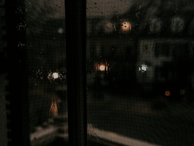 A black framed window looking outside